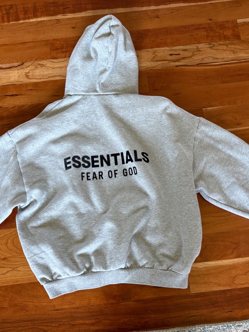 Fear of God ESSENTIALS Light Heather Grey Hoodie with Black Logo